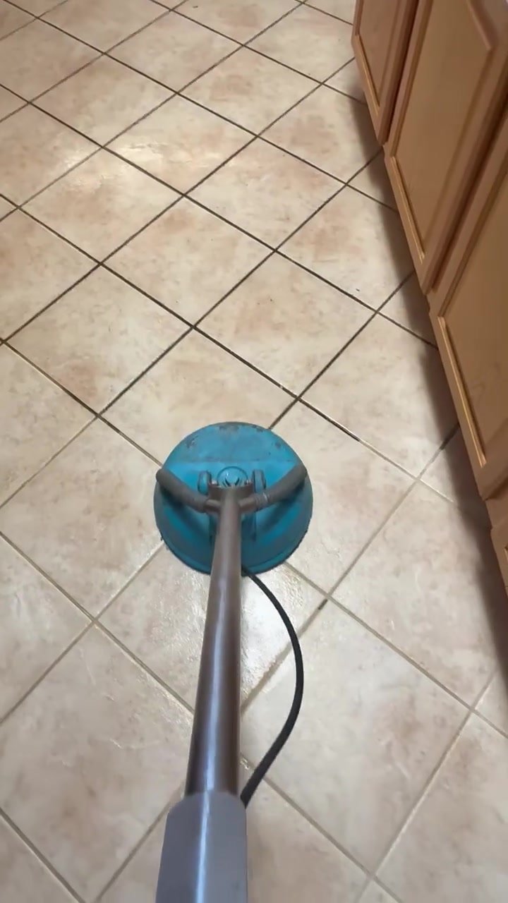 Professional tile cleaning spinner deep-cleaning kitchen tile and grout in a Pasadena, TX home