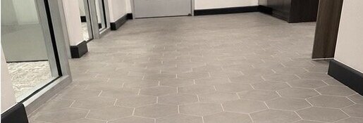 Clean hexagon tile and grout after professional deep extraction cleaning